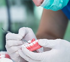 A technician working on a denture